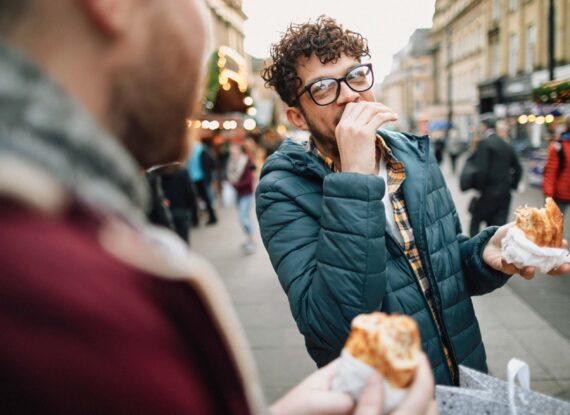 friends eating in the street