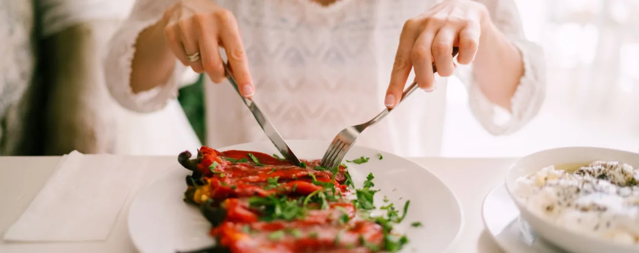 person eating vegetables at restaurant