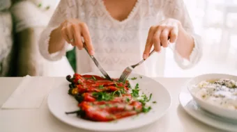 person eating vegetables at restaurant