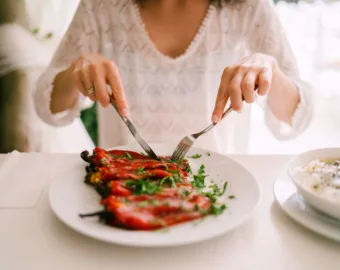 person eating vegetables at restaurant