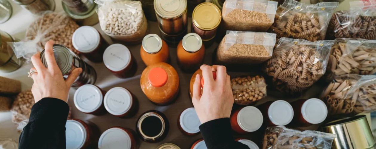 Person organizing different types of food packages