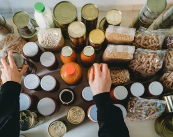 Person organizing different types of food packages