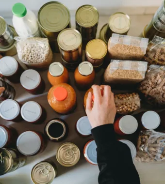 Person organizing different types of food packages