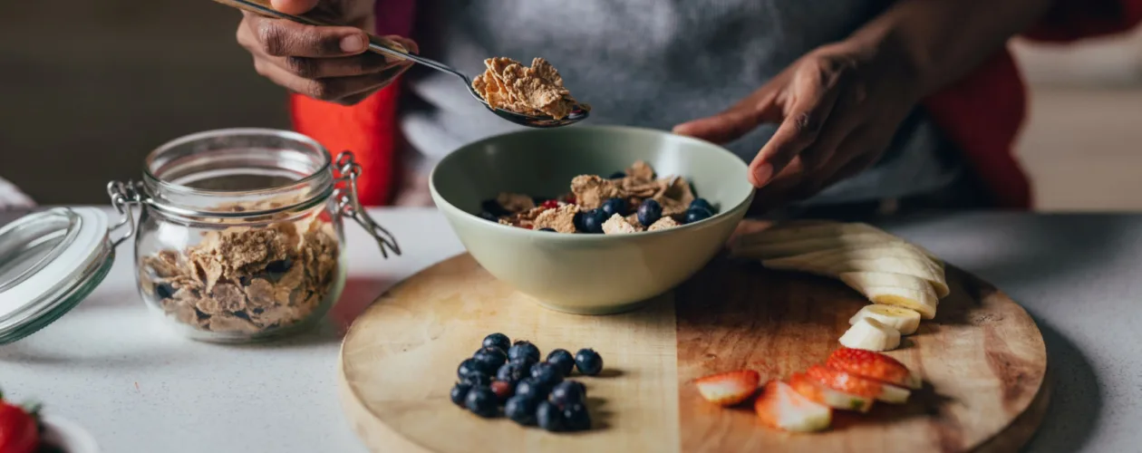 women making oatmeal with fruit toppings