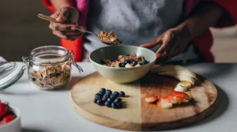 women making oatmeal with fruit toppings