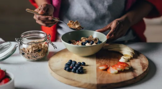 women making oatmeal with fruit toppings